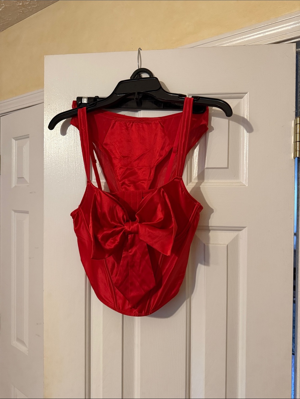 Adore Me Red Bow-Front Satin bra and panty set.